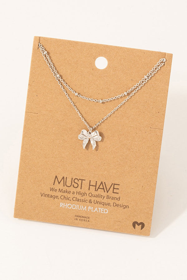 Knotted Ribbon Bow Pendant Necklace -  Rhodium Plated
