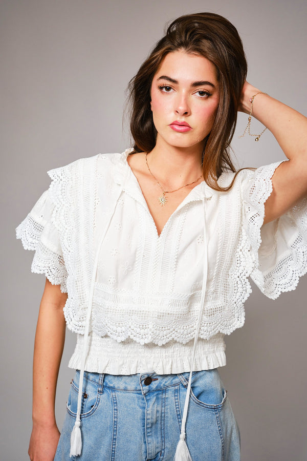 Eyelet Embroidered Tassel Tie Front Crop Top